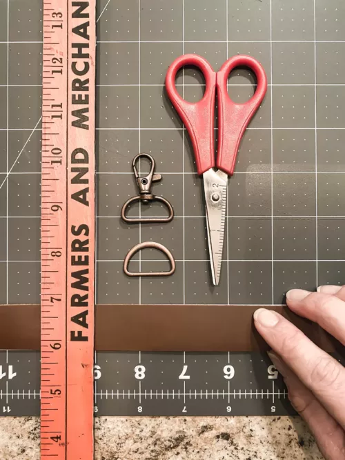 View of the strap material, ruler, and scissors